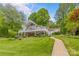 Expansive backyard with multi-level decks, manicured lawn, and lush landscaping at 376 Oak Tree Rd # 37, Mooresville, NC 28117