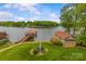 Scenic waterfront property with a boat house and a private yard at 376 Oak Tree Rd # 37, Mooresville, NC 28117