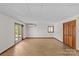 Unfinished basement area featuring wood flooring, an exterior door, and a small window at 376 Oak Tree Rd # 37, Mooresville, NC 28117