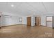 Unfinished basement area featuring wood flooring, storage and access to other rooms at 376 Oak Tree Rd # 37, Mooresville, NC 28117
