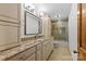 Neutral bathroom featuring granite countertops, dual sinks, and a shower-tub combo at 376 Oak Tree Rd # 37, Mooresville, NC 28117