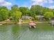 Beautiful lakefront home with boat dock and lush greenery, perfect for waterfront living at 376 Oak Tree Rd # 37, Mooresville, NC 28117