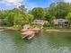 Expansive lakefront property with large house, boat house and lush lawn at 376 Oak Tree Rd # 37, Mooresville, NC 28117