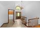 Bright foyer with stairs and views of the laundry and front door at 376 Oak Tree Rd # 37, Mooresville, NC 28117