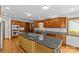 A large kitchen featuring granite countertops, stainless appliances, and a central island cooktop at 376 Oak Tree Rd # 37, Mooresville, NC 28117