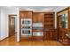 Kitchen featuring stainless steel microwave and oven with wood cabinets and granite counters at 376 Oak Tree Rd # 37, Mooresville, NC 28117