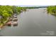Beautiful lake view with multiple boat docks and lush greenery, perfect for waterfront living at 376 Oak Tree Rd # 37, Mooresville, NC 28117