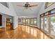 Open-concept living room featuring hardwood floors, lake view windows, and neutral color palette at 376 Oak Tree Rd # 37, Mooresville, NC 28117