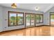 Bright living room featuring hardwood floors, large windows, and serene lake views at 376 Oak Tree Rd # 37, Mooresville, NC 28117