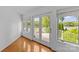 Sunlit room featuring hardwood floors and lovely views of the surrounding lake at 376 Oak Tree Rd # 37, Mooresville, NC 28117