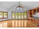 Lake-view room with wood floors and cabinets, arched window, and access to a balcony at 376 Oak Tree Rd # 37, Mooresville, NC 28117