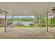 Covered patio with ceiling fans overlooking the lake at 376 Oak Tree Rd # 37, Mooresville, NC 28117