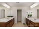Bright bathroom with double vanity, tile floor, and neutral paint color offers a clean and inviting space at 3912 Franklin Meadows Dr, Matthews, NC 28105