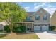 Charming two-story home featuring a stone-accented facade, well-manicured lawn, and a two-car garage at 3912 Franklin Meadows Dr, Matthews, NC 28105