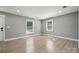 Cozy bedroom featuring sleek flooring, neutral paint, and windows that bring in natural light at 500 Dedmon Dr, Charlotte, NC 28216