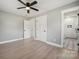 Neutral bedroom with plank flooring and adjoining bathroom at 500 Dedmon Dr, Charlotte, NC 28216