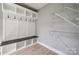 Mudroom with bench, shelving, and hooks, offering ample storage at 500 Dedmon Dr, Charlotte, NC 28216