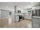 Modern kitchen featuring stainless steel appliances, white cabinets, and marble countertops at 500 Dedmon Dr, Charlotte, NC 28216
