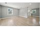 Bright and airy living room with sleek flooring, neutral walls, and ample natural light at 500 Dedmon Dr, Charlotte, NC 28216