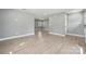 Spacious living area with sleek flooring and fresh neutral paint throughout at 500 Dedmon Dr, Charlotte, NC 28216