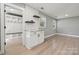 Entryway with tiled accent wall, cabinetry, hooks, and natural light at 500 Dedmon Dr, Charlotte, NC 28216