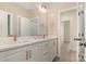 Bathroom features a dual sink vanity with sleek faucets and modern lighting at 5162 Beckenham Ln, Concord, NC 28025