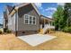 Exterior side view showing a patio, porch, and backyard of this lovely home at 5162 Beckenham Ln, Concord, NC 28025