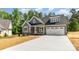 Stylish gray two-story home with white trim and a convenient two-car attached garage at 5162 Beckenham Ln, Concord, NC 28025