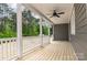 Relaxing covered porch with a ceiling fan, offering a perfect spot to enjoy the outdoors at 5162 Beckenham Ln, Concord, NC 28025