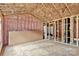 Unfinished bathroom featuring exposed framing, pink insulation, and open shower space at 530 Gantt St, Mooresville, NC 28115
