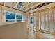 Unfinished room with exposed framing and a large window overlooking a lush green landscape at 530 Gantt St, Mooresville, NC 28115