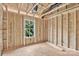 Framed-in bedroom featuring a large window showing the exterior and natural light, showcasing the room's design and layout at 530 Gantt St, Mooresville, NC 28115