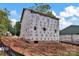 New construction shows exterior with windows, sheeting and foundation on a sunny day at 530 Gantt St, Mooresville, NC 28115