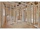 An interior view showcasing the wooden framework during the construction phase of the home with visible plumbing and electrical at 530 Gantt St, Mooresville, NC 28115