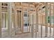 The wood frame of a home's interior, revealing a room's structure and design with windows, plumbing, and electrical components at 530 Gantt St, Mooresville, NC 28115