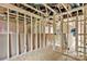 Unfinished room featuring exposed framing, pink insulation, and electrical wiring at 530 Gantt St, Mooresville, NC 28115