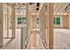 A partially constructed stairwell shows a framed entrance with a view to the outside from the upper floor, revealing natural light at 530 Gantt St, Mooresville, NC 28115