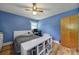 Comfortable bedroom with natural light, wood floors, and a neutral color scheme at 5938 Mundy Rd, Denver, NC 28037
