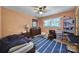 Cozy bedroom with a navy rug, wood floors, and a ceiling fan at 5938 Mundy Rd, Denver, NC 28037