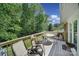 Relaxing deck with outdoor seating overlooking a beautiful wooded backyard at 5938 Mundy Rd, Denver, NC 28037