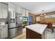Modern kitchen featuring stainless steel appliances, white cabinets, and a quartz countertop island at 5938 Mundy Rd, Denver, NC 28037