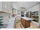 Bright kitchen with white cabinetry, stainless steel appliances, marble countertops, and a wooden island at 5938 Mundy Rd, Denver, NC 28037