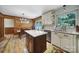 Bright eat-in kitchen featuring white cabinets, an island, and stainless steel appliances at 5938 Mundy Rd, Denver, NC 28037