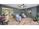 Cozy living room featuring comfortable armchairs, stylish decor, and views of the kitchen at 5938 Mundy Rd, Denver, NC 28037