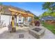 Well-appointed backyard with pergola, fire pit, and comfortable outdoor seating at 6002 Sentinel Dr, Indian Trail, NC 28079