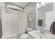 Well-lit bathroom featuring a shower-tub combo, a framed mirror, and a sleek white vanity at 6002 Sentinel Dr, Indian Trail, NC 28079