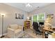 Inviting bedroom with a cozy chair, well-placed desk, and lots of natural light at 6002 Sentinel Dr, Indian Trail, NC 28079
