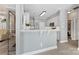 Modern kitchen featuring white cabinetry, stainless steel appliances, and a seamless flow into adjacent living spaces at 6002 Sentinel Dr, Indian Trail, NC 28079