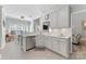 Stylish kitchen featuring white cabinetry, modern appliances, and an open view to the dining area for easy conversation at 6002 Sentinel Dr, Indian Trail, NC 28079