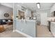 Contemporary kitchen with quartz countertops, stainless steel appliances, and a pass-through to the living area at 6002 Sentinel Dr, Indian Trail, NC 28079